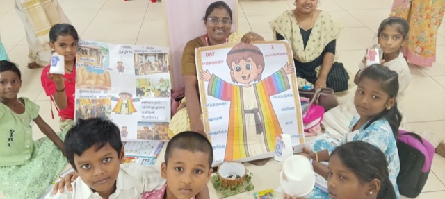 Children showing their Bible craft sheets
