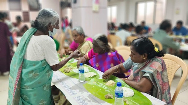 Serving a meal to elderly guests